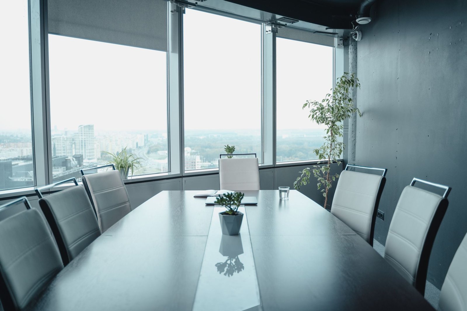 Empty boardroom overlooking a city skyline